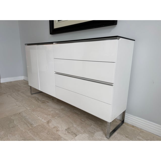 Custom white lacquer sideboard credenza with four easy push drawers and a two-door cabinet. Single best piece of furniture...
