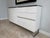 Custom white lacquer sideboard credenza with four easy push drawers and a two-door cabinet. Single best piece of furniture...