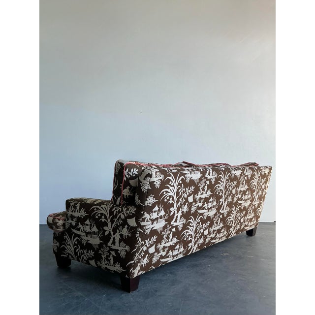 This stunning vintage sofa is a masterclass in Hollywood Regency style, featuring iconic Chinoiserie fabric from the...