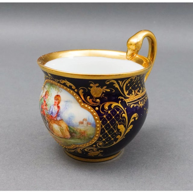 Meissen Antique Cobalt Blue Raised Gold Gild Hand Painted Courting Couple Scene Porcelain Tea Cup. Measures approximately...