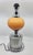 Pierre Disderot's majestically designed Diderot lamp features an orange opaline globe, supported by a carefully crafted...