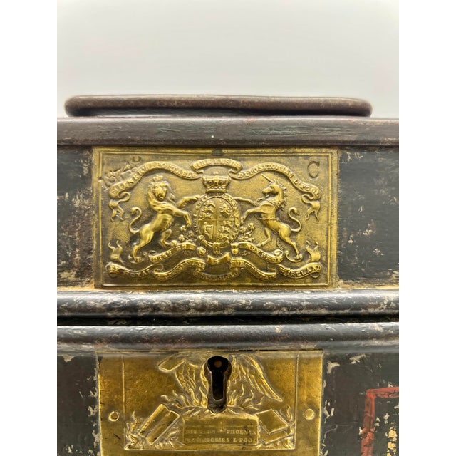 This 19th-century English iron strongbox, crafted by Thomas Milner & Son of Liverpool, is an exceptional example of secure...