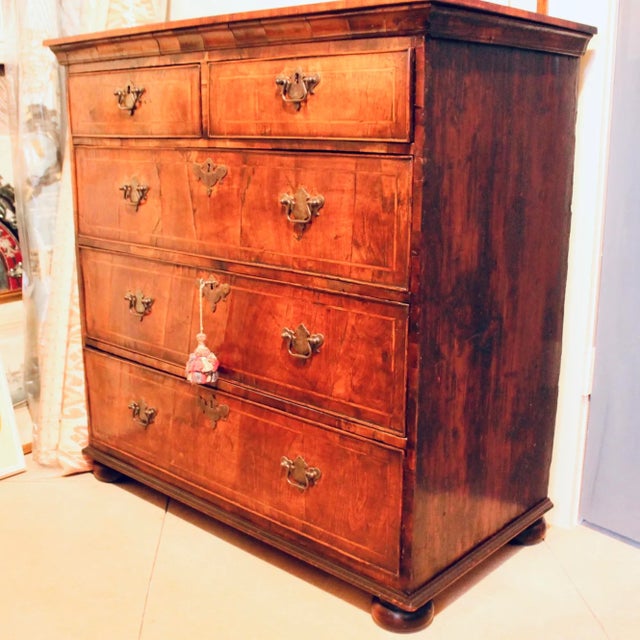 A rare early 18th century George I / George II period (ca. 1720-1740) chest of drawers of refined proportions, with a two...