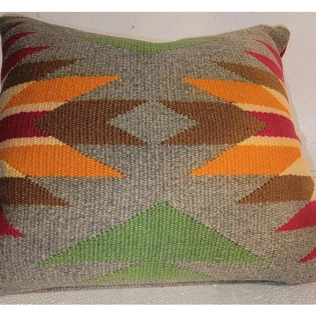 German Town weaving pillow from a saddle blanket.The insert is down & feather fill. The backing is in a red linen.