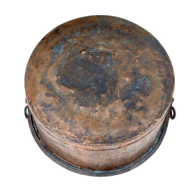19th century copper cooking vessel circa 1890. Good quality circular copper pot with rounded bottom. Hand riveted iron...