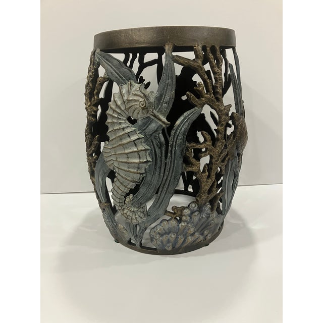 This cast aluminum accessory table has under the sea designs including seahorses, coral & turtles. Made in the 90’s it has...