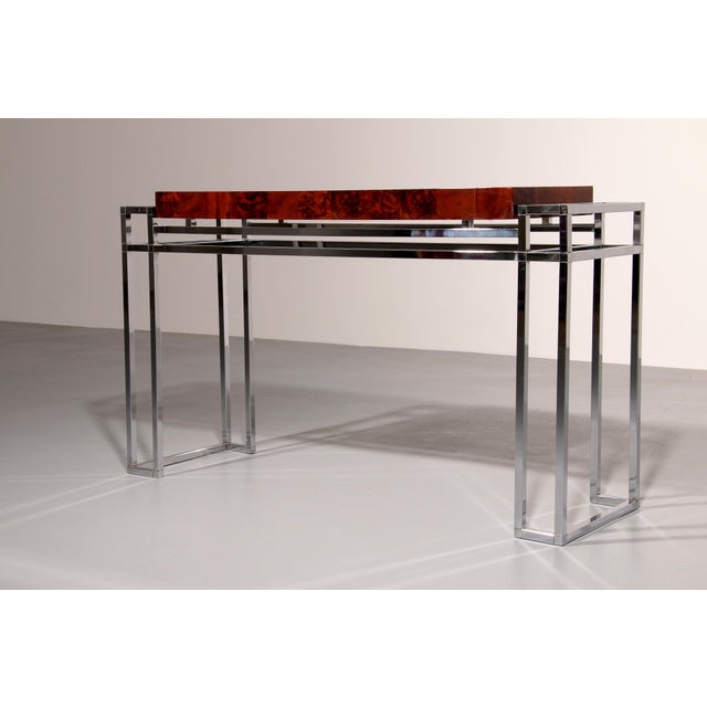 Refined and elegant console in chrome and wood, one of a kind design; chrome and wood design go perfectly together. This...