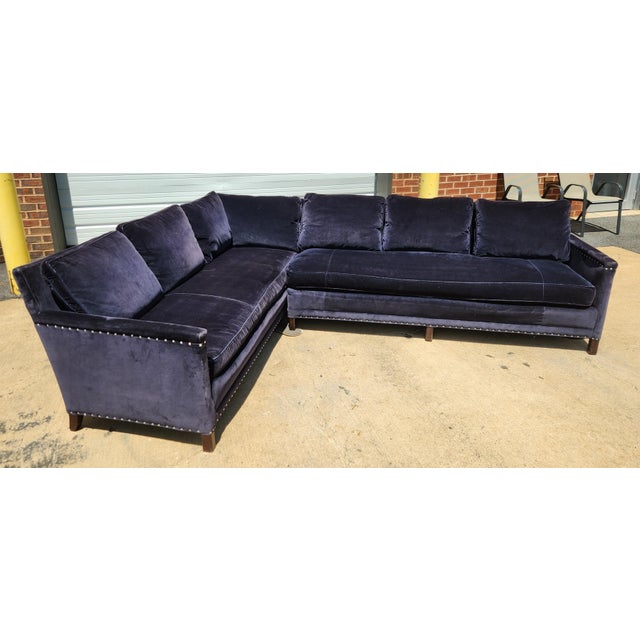 Two-piece blue velvet sectional sofa from Lillian August with plush proportions and a tailored designer look. The...