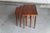 Set of 3 nesting tables designed and produced in Denmark during the 1960’s. These dark teak veneer tables are an elegant...