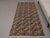 Vintage Hand-Knotted runner rug is a semi-antique vintage area rug. The '70s Eastern region of Anatolia's unique rug is...