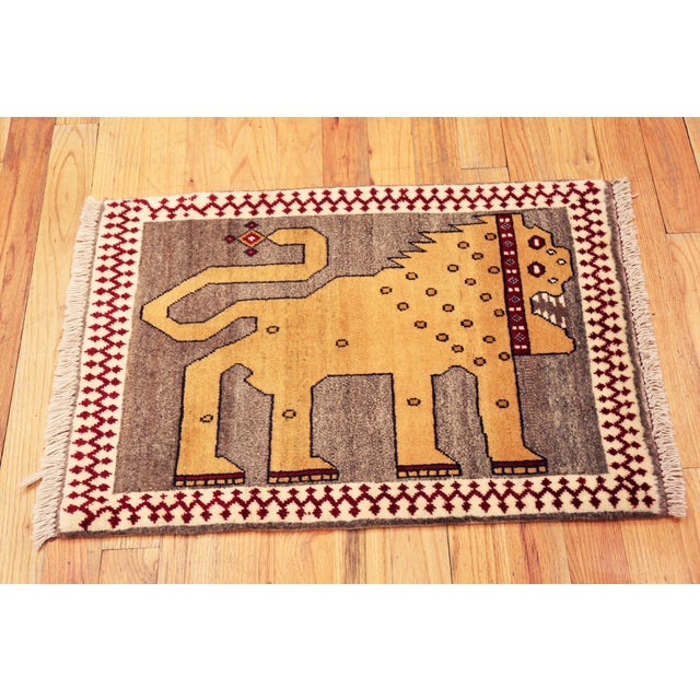 Fierce Folkloric Lion Design Vintage Tribal Persian Gabbeh Rug, Country of Origin: Persia, Circa Date: 1950 This vintage...