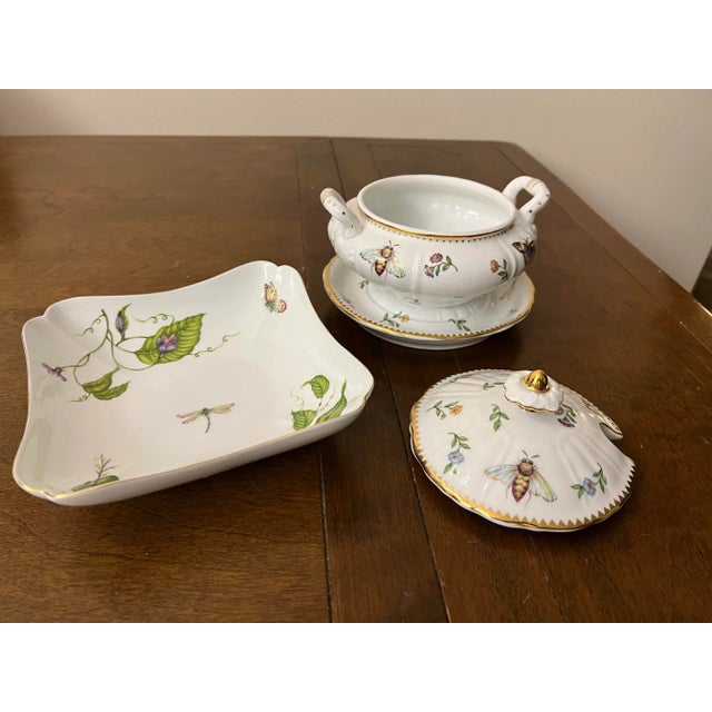 Beautiful white china trimmed in gold with various insects and flowers. Made by I Godinger & Co. Bowl measures 7” x 7”...