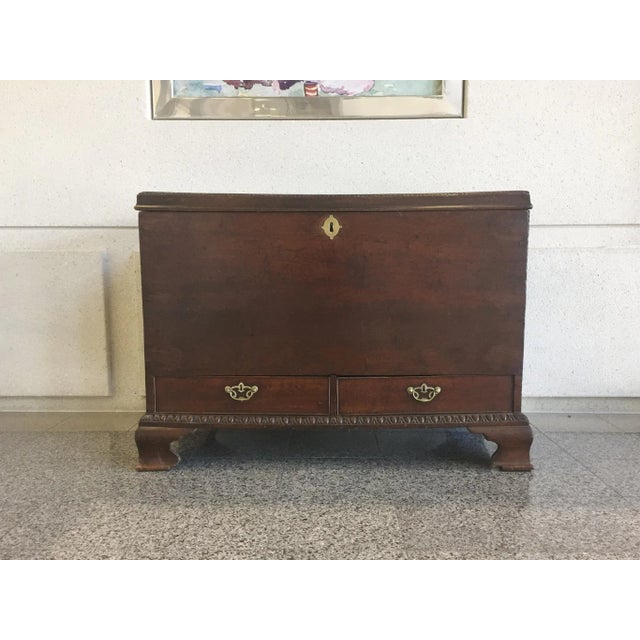 A handsome, well-aged George III trunk. Late 18th Century. The chest is comprised of mahogany wood with a warm reddish...