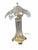A striking vintage crystal table lamp featuring a sculptural clear crystal body paired with elegant brass-tone accents....