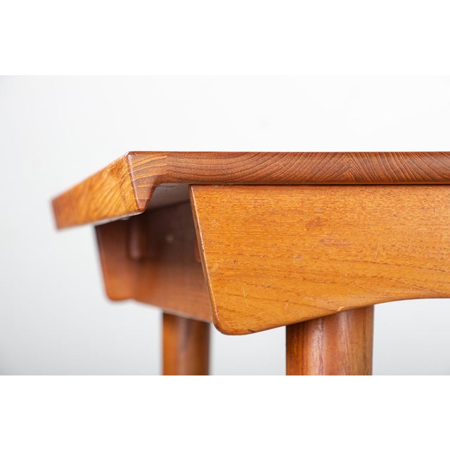 Exceptional, very large Scandinavian table in solid teak. Rectangular in shape, it has two extensions that store neatly in...