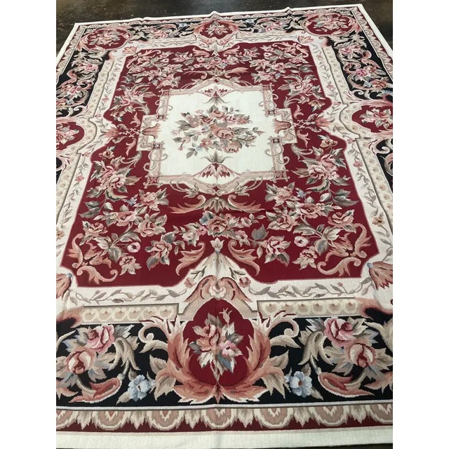 ACTUAL SIZE: 8'0" x 10'0" PRIMARY COLOR: Burgundy AGE: New ORIGIN: China MATERIALS: Wool FOUNDATION: Cotton PRODUCTION:...