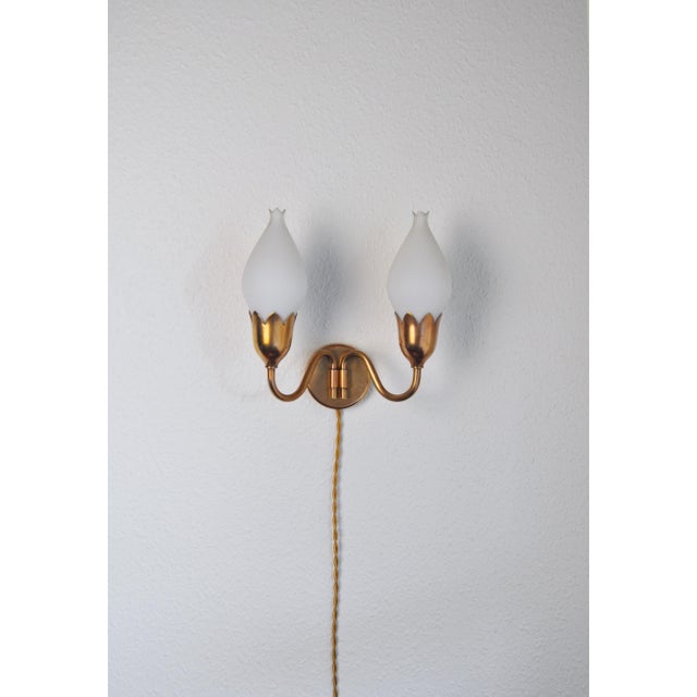 Danish Modern wall light designed by Ansgar Fog & Erik Mørup Produced by Fog & Mørup in Denmark. Frame and 2 arms in...