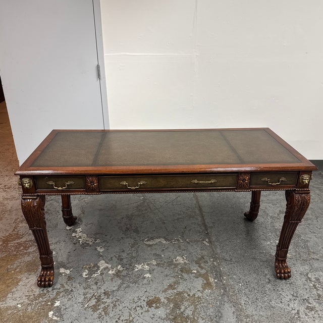 Design Plus Gallery presents a Vintage Chippendale Revival Writing Desk. The desk features a leather inset top, tooled...