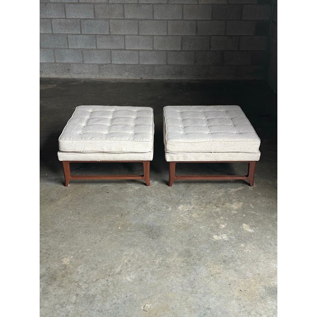 A large scale pair of ottoman’s from Dunbar‘s Janus collection. Features elegant, slightly tapered, walnut legs, and...