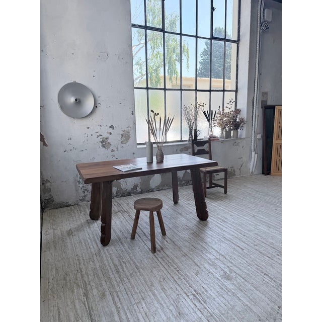 A beautiful solid oak dining table from the 1970s by the belgian furniture manufacturer de puydt. we love the very thick...