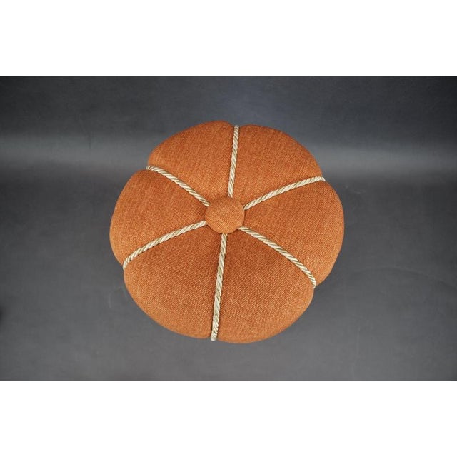 This sculptural upholstered footstool dates from the 1950s and originates from Czechoslovakia. Its compact, rounded...