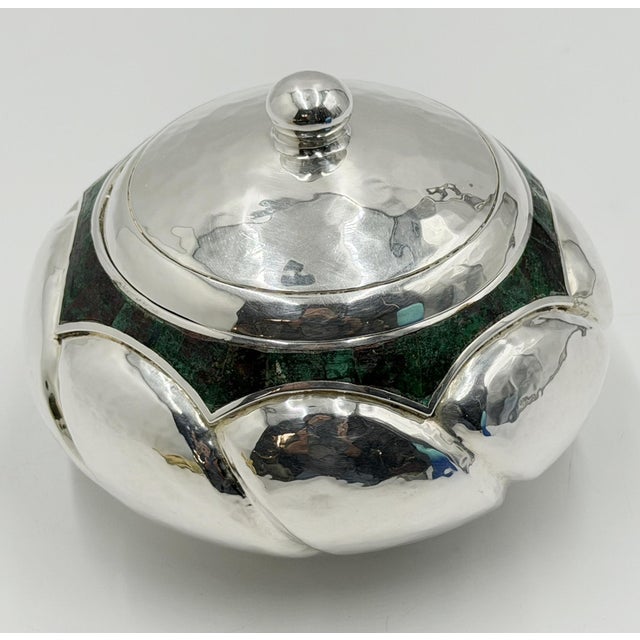 A striking vintage Los Castillo lidded bowl from Taxco, Mexico, combining sculptural Mexican metalwork with richly colored...