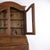 Antique secretary desk crafted from oak with brass fittings and an upper glazed display cabinet. The piece was made around...