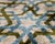 "A refined balance of structure and softness, this handmade Ikat lumbar pillow introduces a geometric trellis motif...
