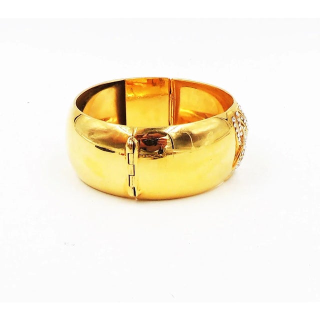 1980s goldtone rhinestone cuff bracelet with box clasp. Marked "Bijoux Cascio." Condition: Very good; minor wear to metal....