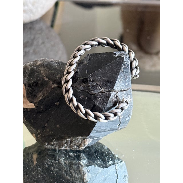 Vintage open cuff bracelet featuring chunky, twisted and braided link forms arranged in a dimensional cable inspired...