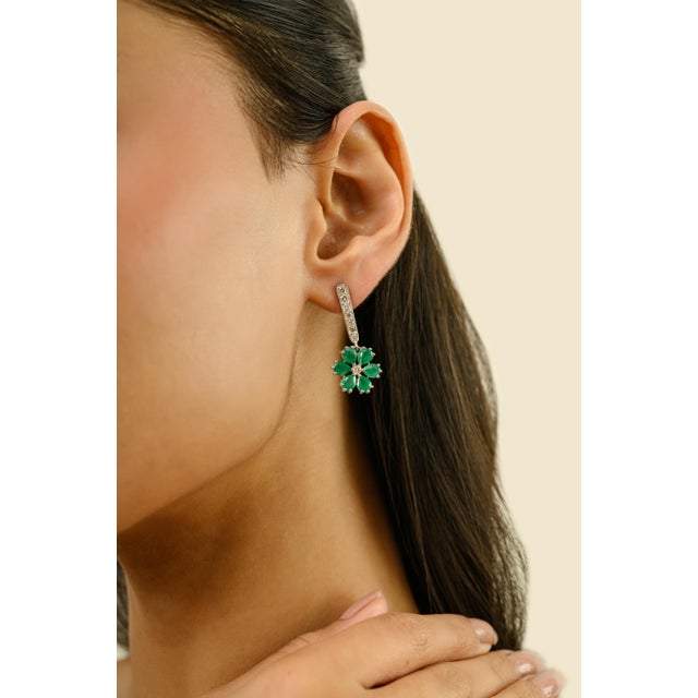 These elegant drop earrings features 12 pear cut emerald totaling 3.33 carats, set in 18k white gold. Each emerald...