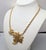 L:ate 1970s or early 1980s goldtone two openwork leaves with curled edges one bigger than the other on a chain necklace...