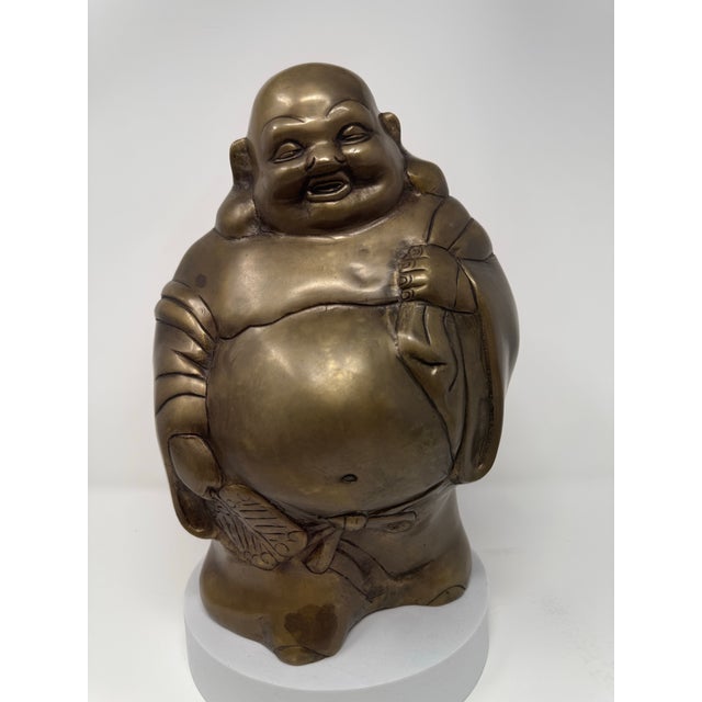 Substantial vintage cast brass sculpture depicting Budai, the jovial monk popularly known as the Laughing Buddha....