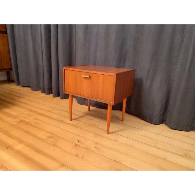 VEB Möbelfabrik nightstand from the 1960s. In original and good condition. Very good workmanship of natural veneer and...