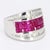 This is an eye catching ring with three rows of princess cut lab rubies, and two more rows of tapered baguette diamonds...