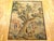 A French Aubusson rustic tapestry from the late 17th century, depicting several villagers on either side of a large tree...