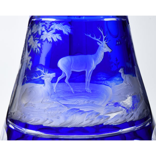 Description - A large and beautiful cobalt blue glass pitcher with applied clear glass handle. It is decorated with a...