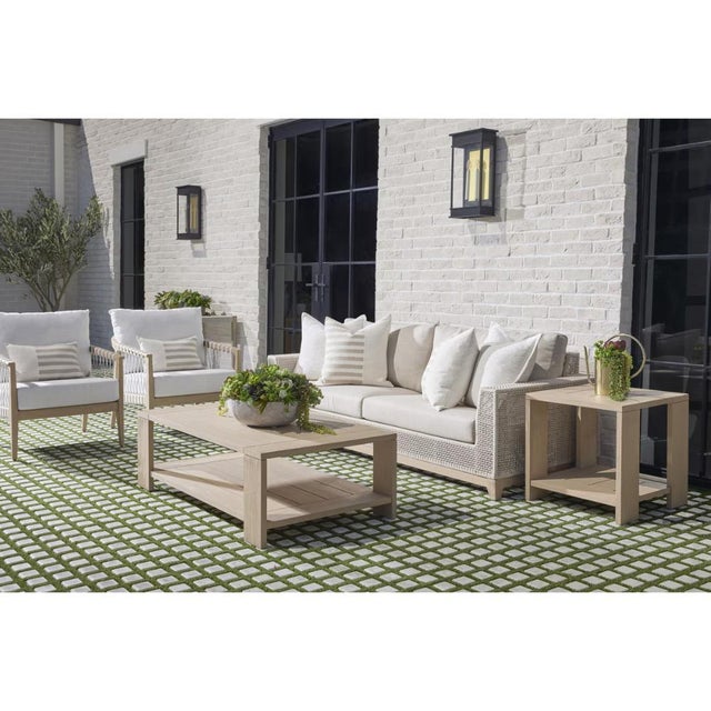 The Sur Wooden Rectangular Outdoor Coffee Table brings solid teak construction and a washed ever teak finish to your patio...