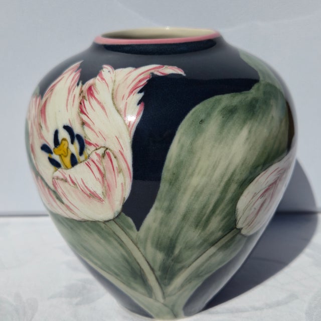 A beautiful hand-painted art pottery vase from Santa Barbara Ceramic Design, dated 1986, marked “SBCD” on the base and...