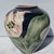 A beautiful hand-painted art pottery vase from Santa Barbara Ceramic Design, dated 1986, marked “SBCD” on the base and...