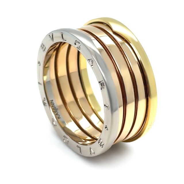 A bold and iconic Bvlgari B.Zero1 four-band ring crafted in a striking combination of 18ct white gold, rose gold, and...