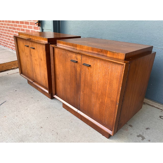 A striking matched pair of Brutalist walnut nightstands by Tobago, the celebrated Canadian furniture manufacturer whose...