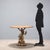 Coffee table with painted metal moorish figure. Top and base in marbled and ebonized wood. The figure of the moorish...