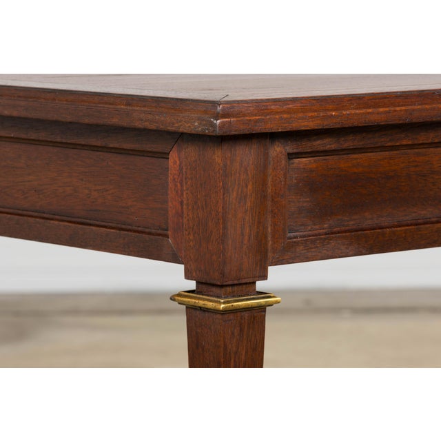 Elegant French Louis XVI style coffee table crafted in mahogany, sourced in Provence and dating to the mid-20th century....