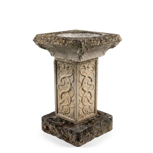 A sophisticated and highly textural vintage garden birdbath, this piece features a heavy, chamfered square basin set atop...