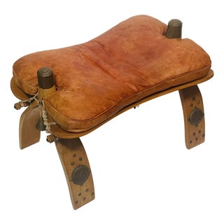 Antique Moroccan Camel Saddle Leather Footstool With Bronze Bell For Sale
