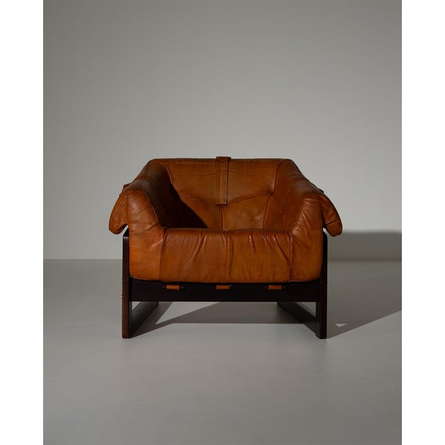 Percival Lafer MP-93 lounge chair, designed and manufactured in Brazil in 1972. Sculptural dark wood frame with its...