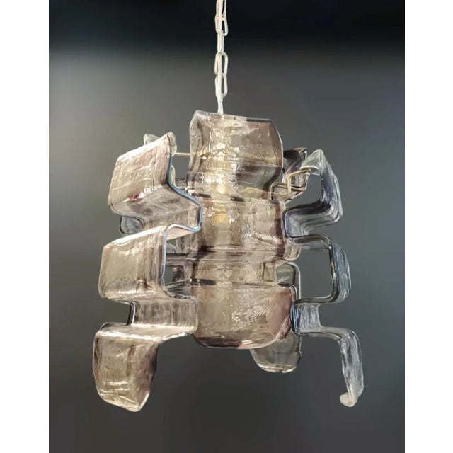 Vintage Italian chandelier with curved "wavy" smoky and clear Murano glass petals mounted on brass frame, designed by...