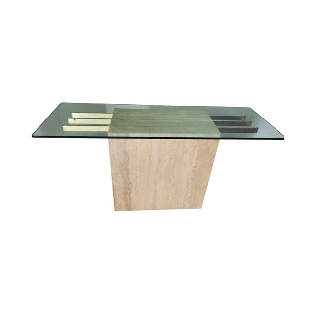 Available is a beautiful Travertine Console table with brass inserts and a glass top. This table is in really good...