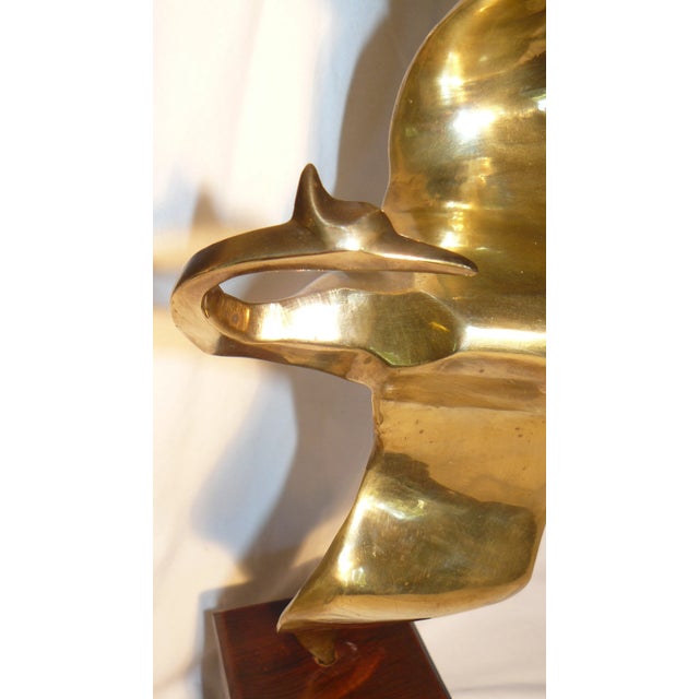 Simply beautiful.... this sculpture, etched with a "1" on the back of the wing just above where it meets the wood base,...